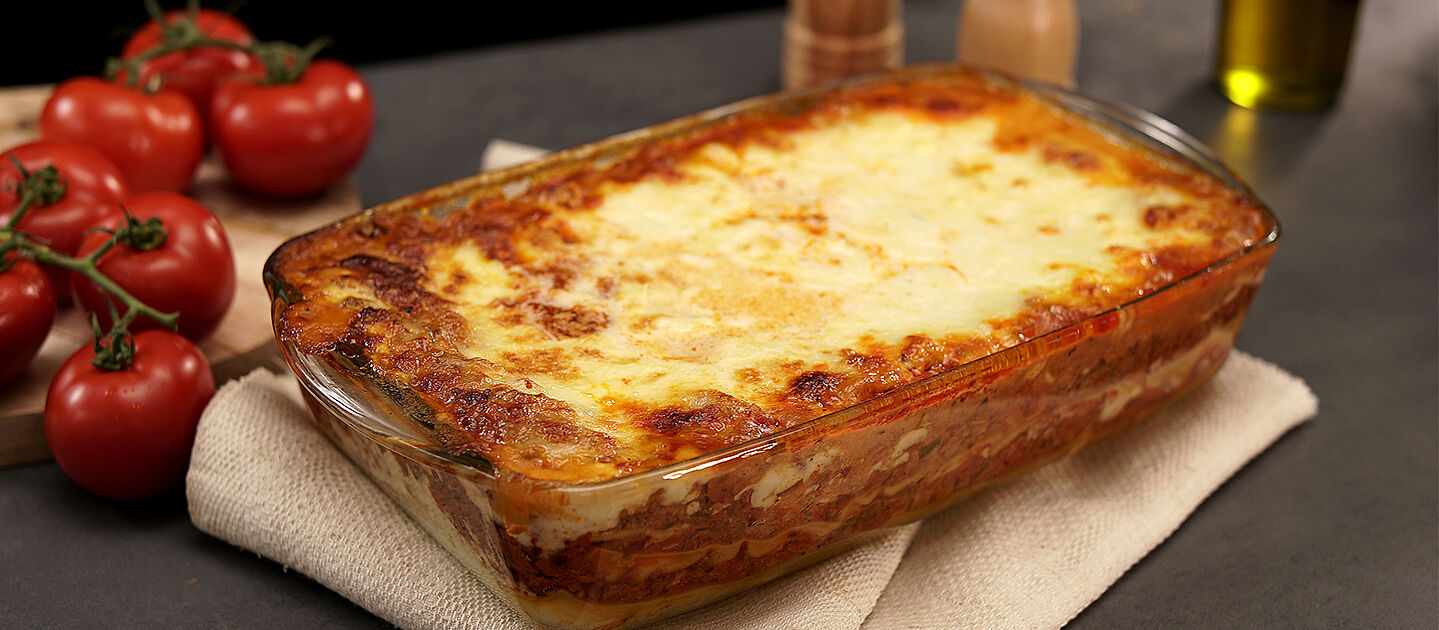 Lasagne on a beige cloth.