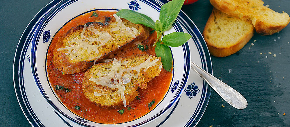 Venetian tomato soup in a white and blue bowl.