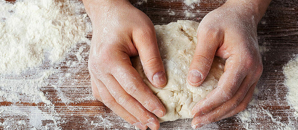 Pizza dough is kneaded.