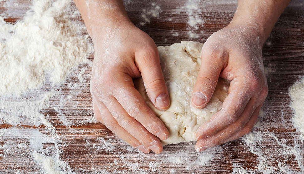 Pizza dough is kneaded.