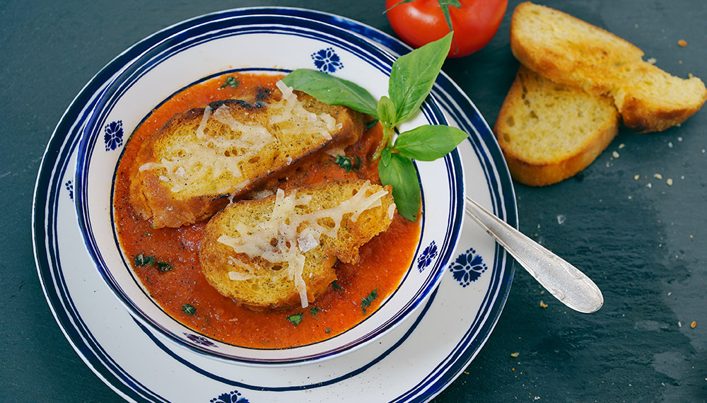 Venetian tomato soup in a white and blue bowl.